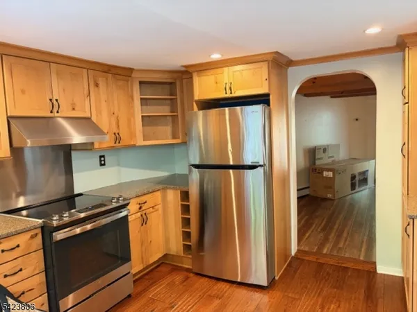 a kitchen with stainless steel appliances a stove and a refrigerator
