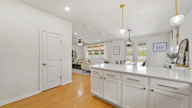 a spacious bathroom with a granite countertop sink mirror and vanity