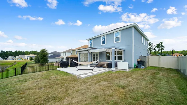 a front view of house with yard and entertaining space