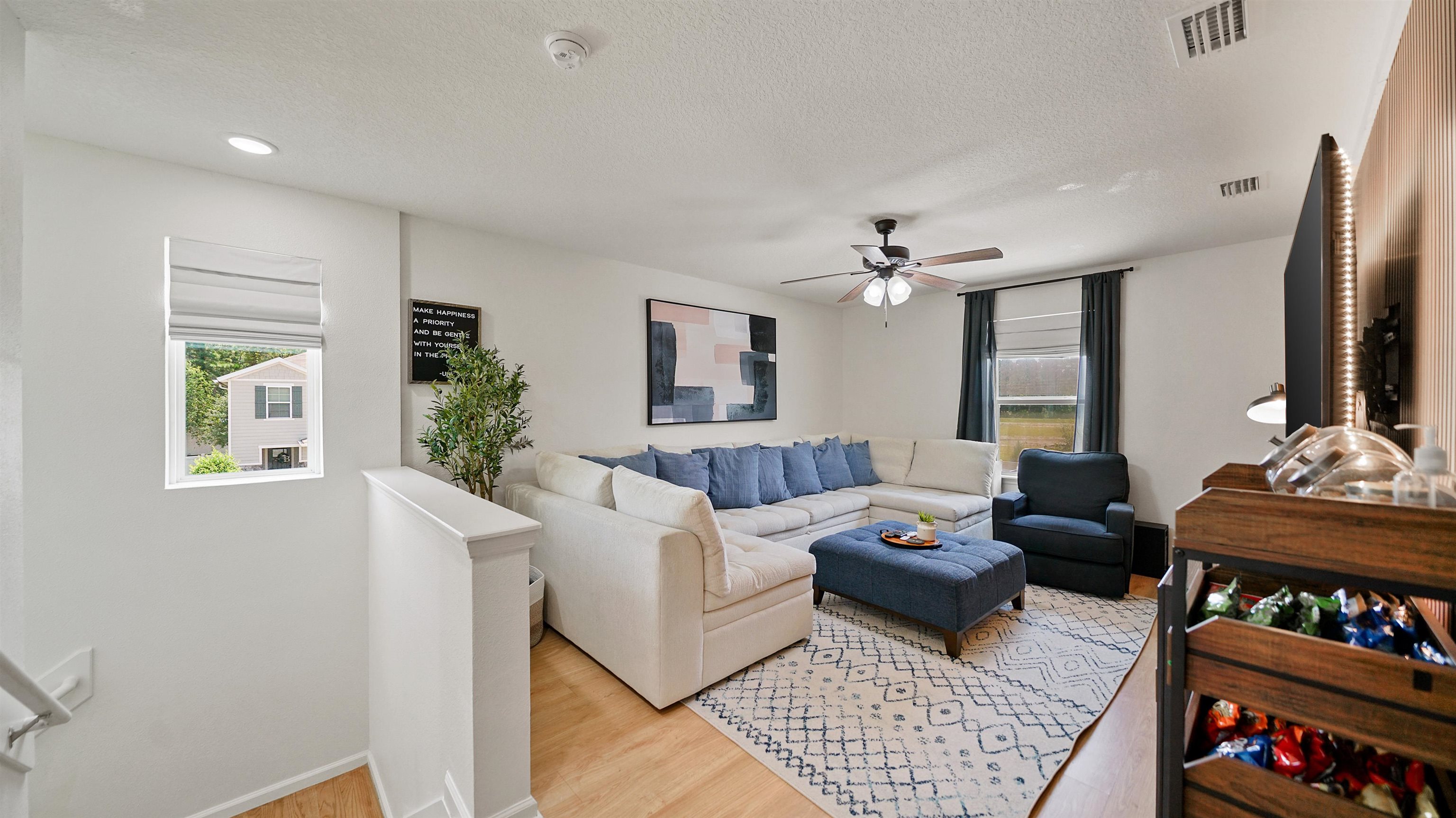 9658 Freefall Road Jacksonville, FL 32221 - Photo 22 of 39 a living room with furniture and a flat screen tv