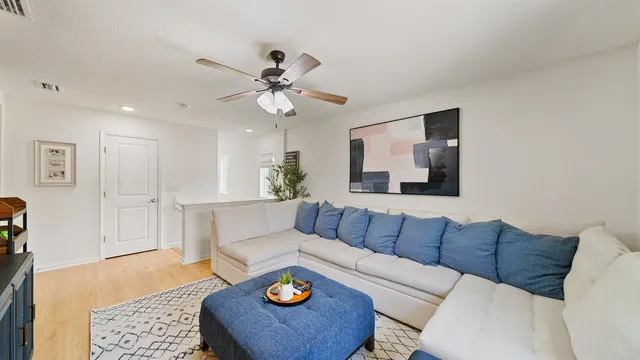 a living room with furniture and a rug