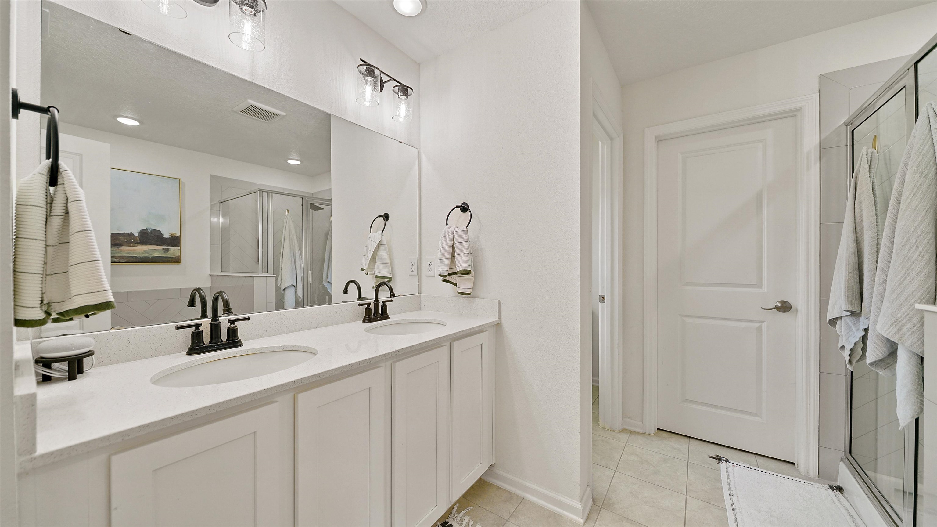 9658 Freefall Road Jacksonville, FL 32221 - Photo 26 of 39 a bathroom with a double vanity sink mirror and