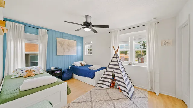 a bedroom with double bed and a window