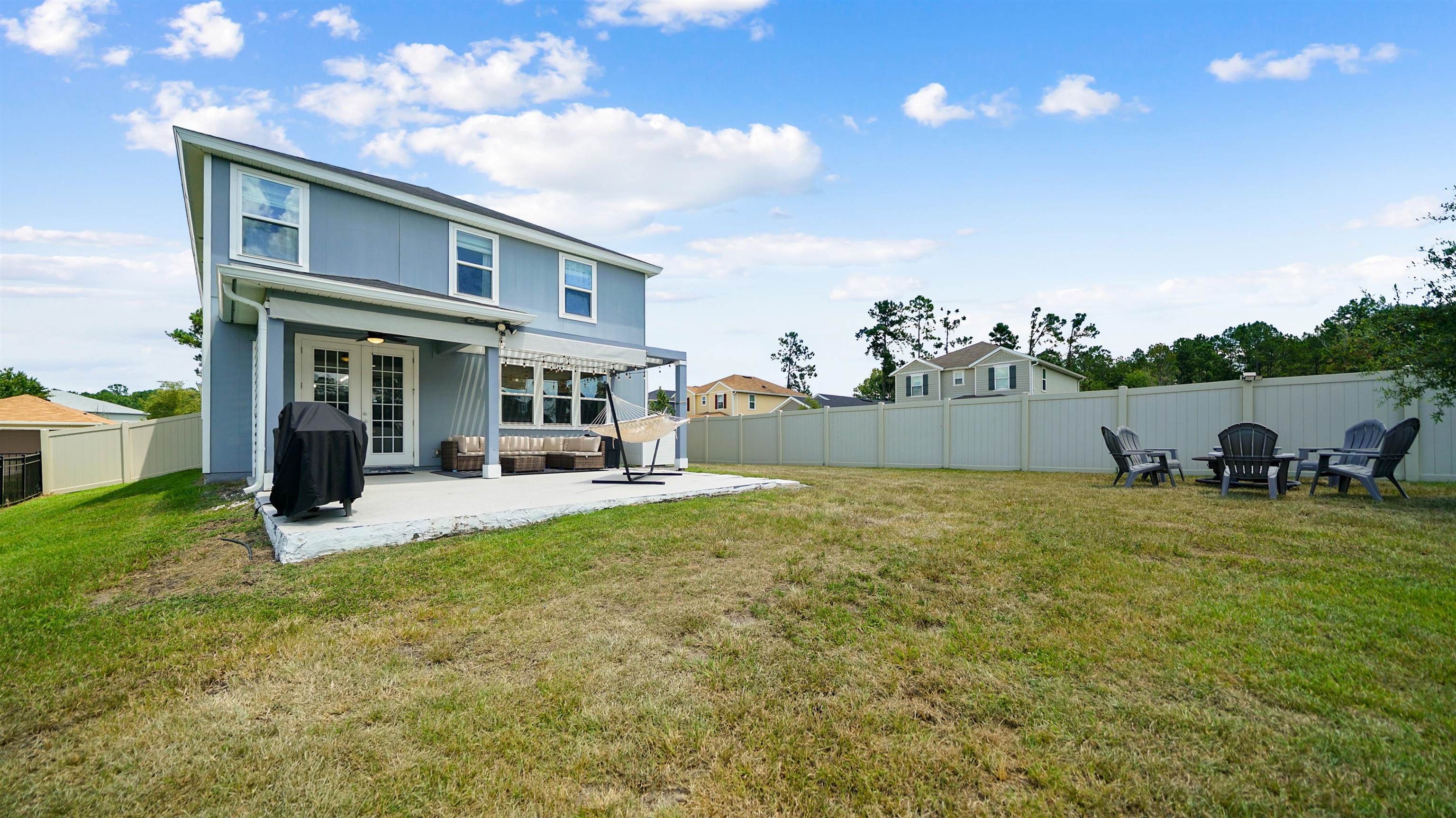 9658 Freefall Road Jacksonville, FL 32221 - Photo 33 of 39 a view of a house with backyard porch and sitting area