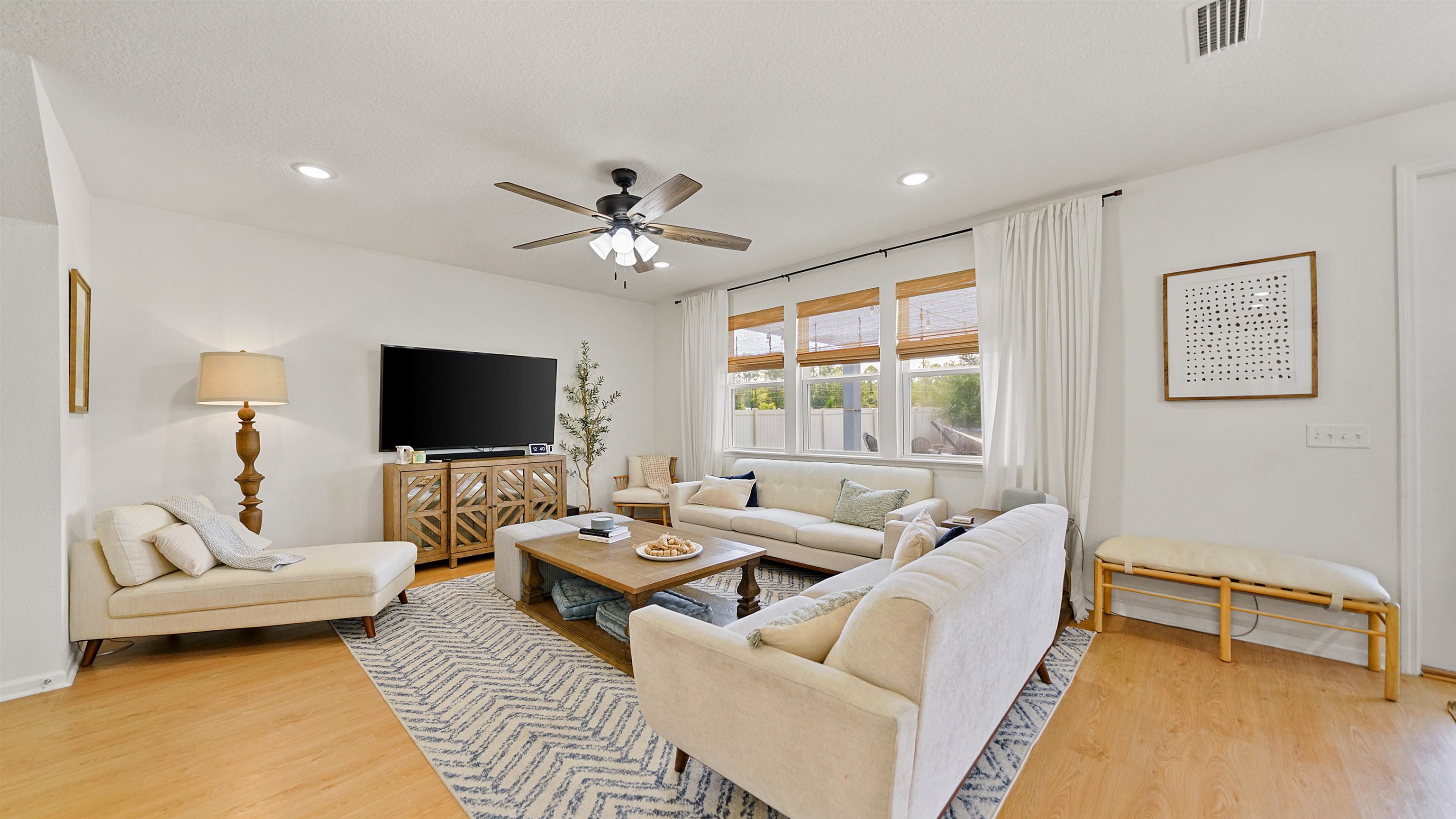 9658 Freefall Road Jacksonville, FL 32221 - Photo 9 of 39 a living room with furniture and a flat screen tv