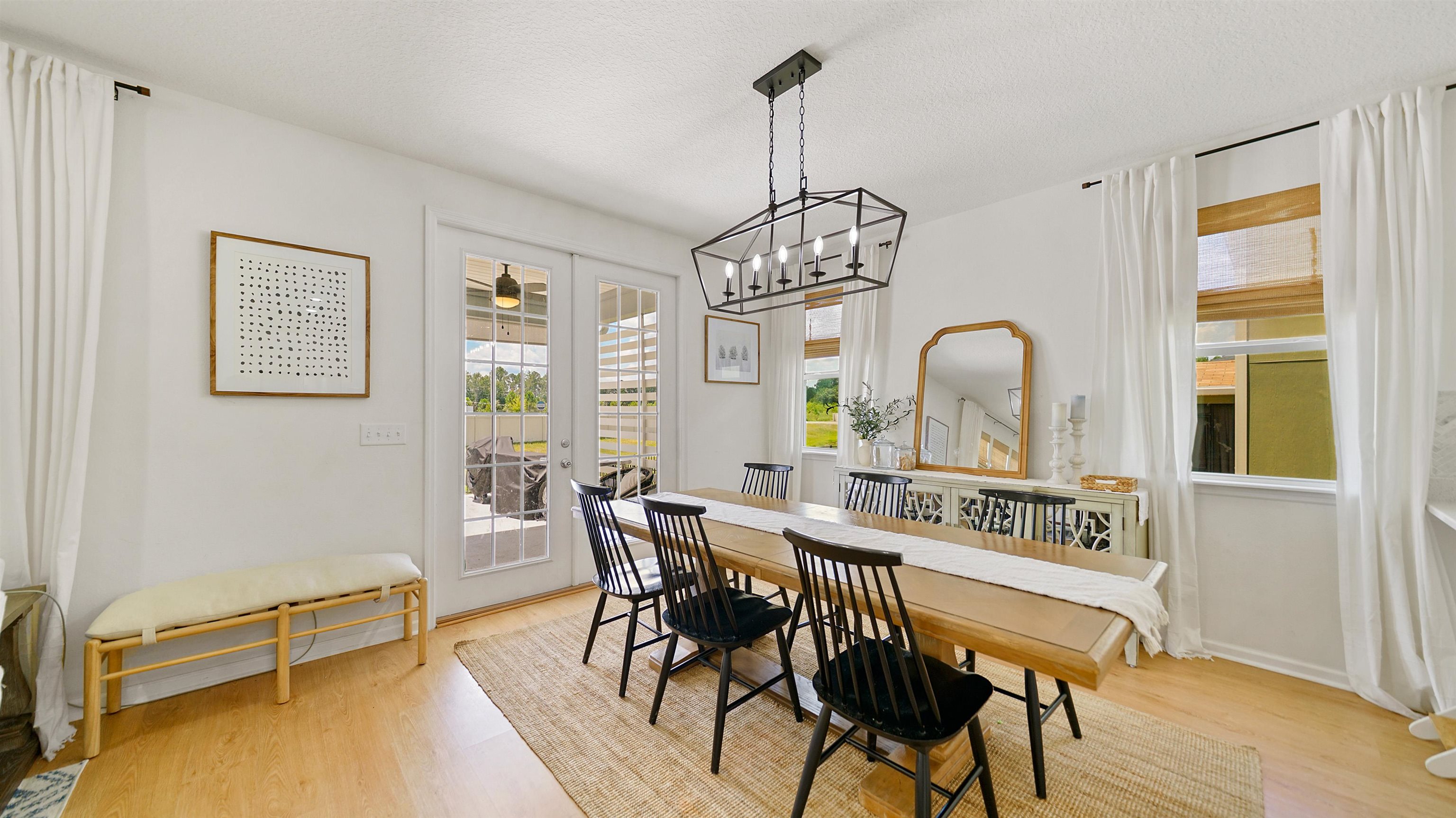 9658 Freefall Road Jacksonville, FL 32221 - Photo 10 of 39 a view of a dining room with furniture window and wooden floor