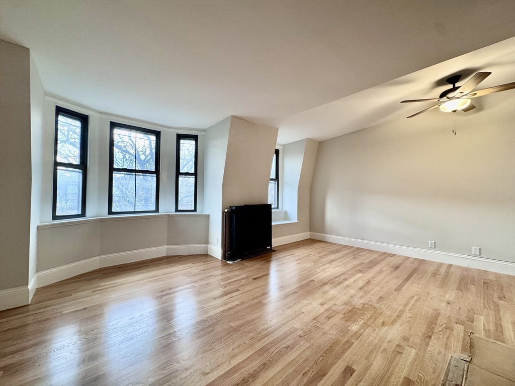 169 West Brookline Street, Unit PH Boston, MA 02118 - Photo 1 of 19 wooden floor in an empty room with a window