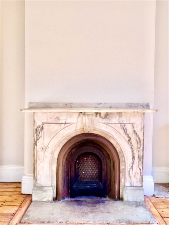 169 West Brookline Street, Unit PH Boston, MA 02118 - Photo 15 of 19 a living room with a fireplace