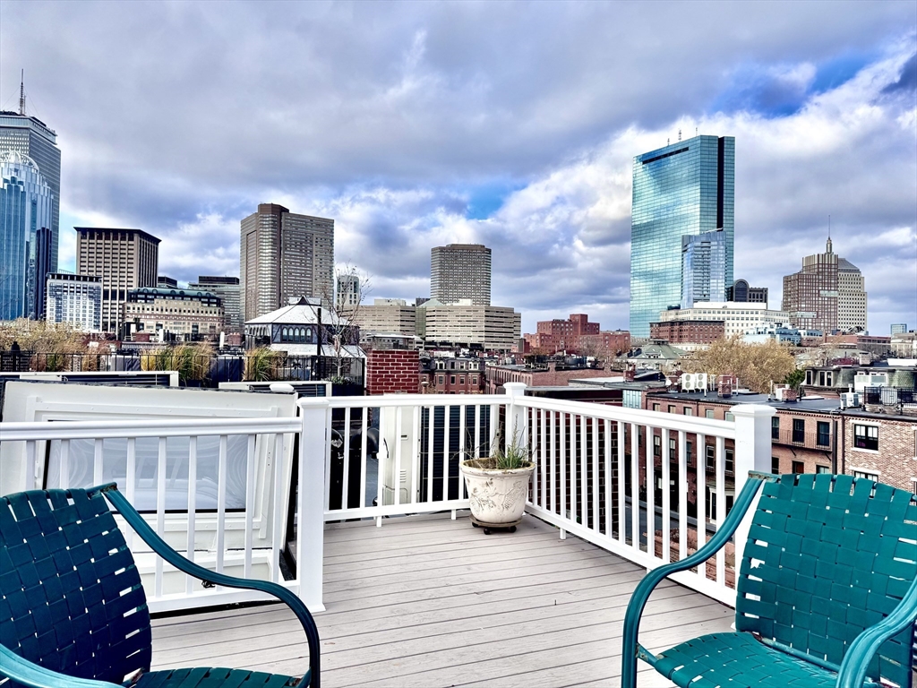 169 West Brookline Street, Unit PH Boston, MA 02118 - Photo 7 of 19 a view of a chair and tables in the balcony