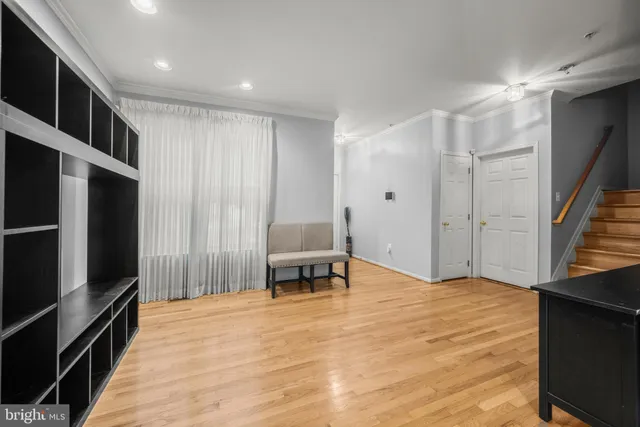 a view of kitchen with furniture and a refrigerator