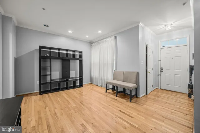 a spacious bedroom with a bed and a window