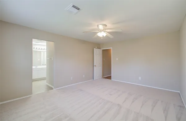 a view of empty room with windows
