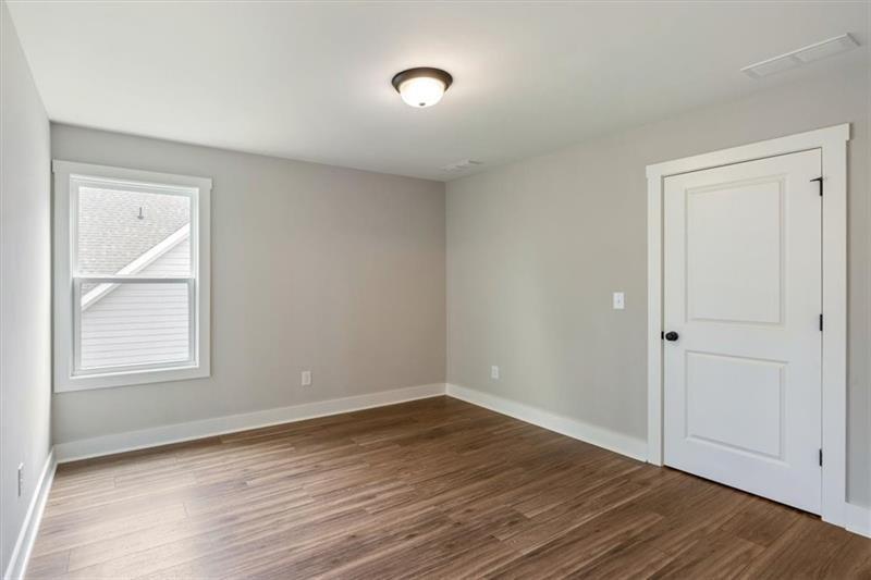 131 Old Alabama Road Southeast Emerson, GA 30137 - Photo 30 of 44 a view of an empty room with wooden floor and a window