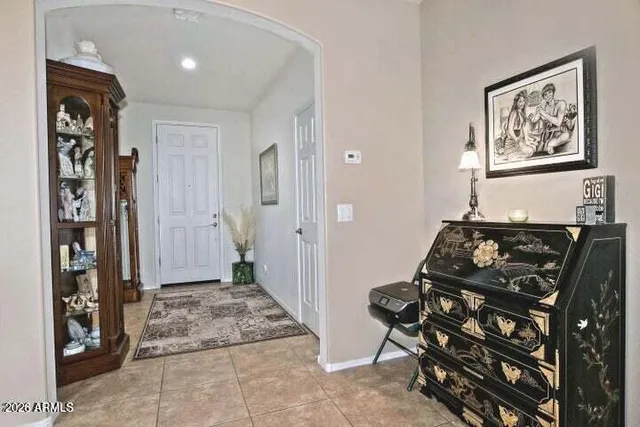 a living room with lots of furniture and kitchen view