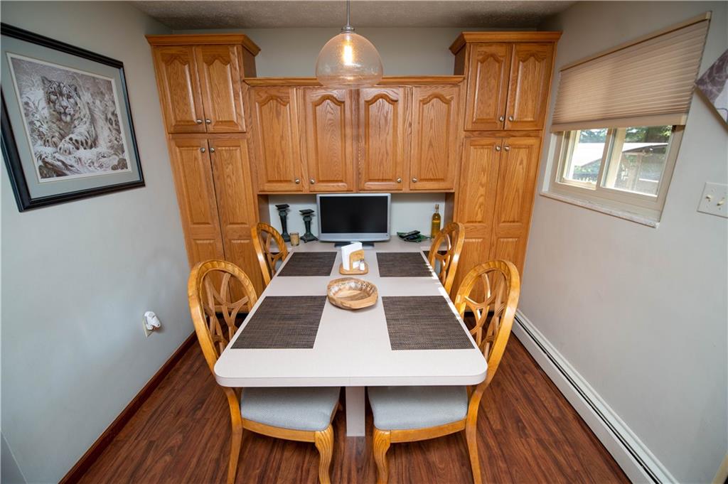123 Dalecrest Road Verona, PA 15147 - Photo 12 of 25 a view of a dining room with furniture and wooden floor