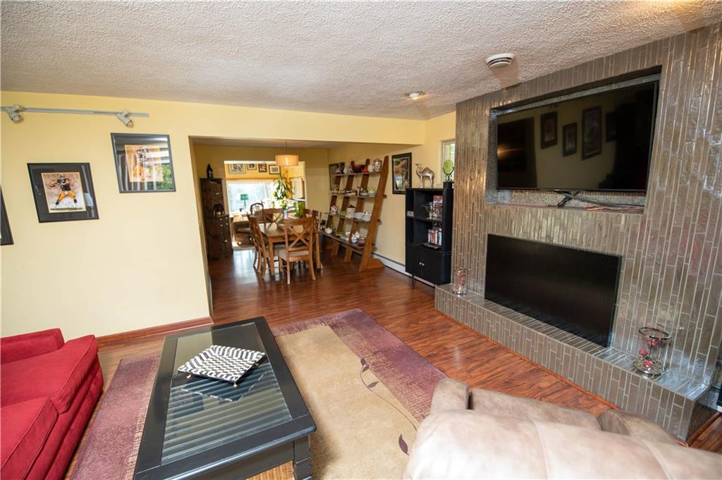 123 Dalecrest Road Verona, PA 15147 - Photo 8 of 25 a living room with furniture and a flat screen tv