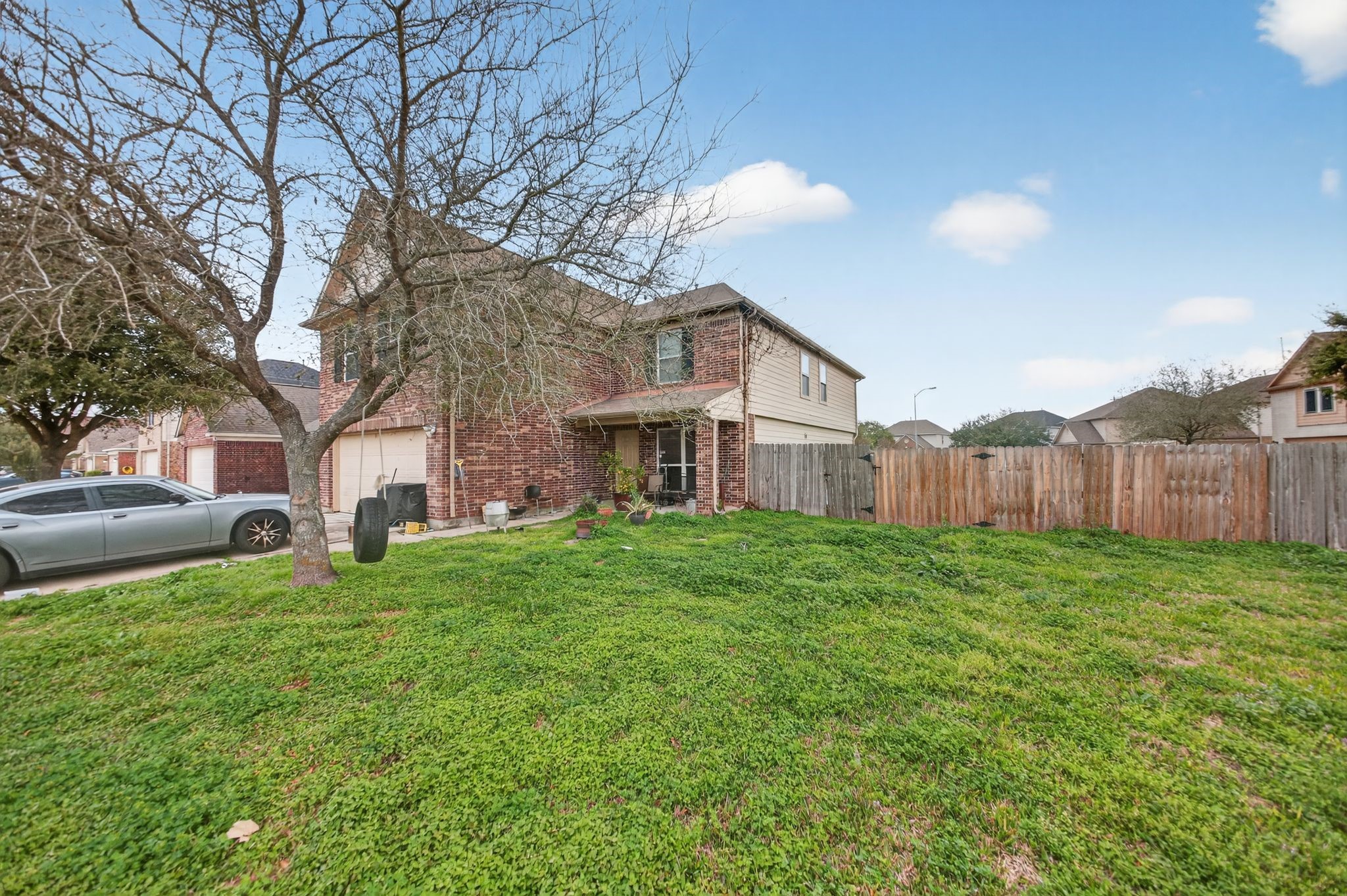 7902 Sesame Street Baytown, TX 77521 - Photo 3 of 24 a view of a house with a big yard