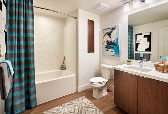 19525 Nordhoff Street, Unit 25662 Northridge, CA 91324 - Photo 11 of 26 a bathroom with a sink toilet and shower