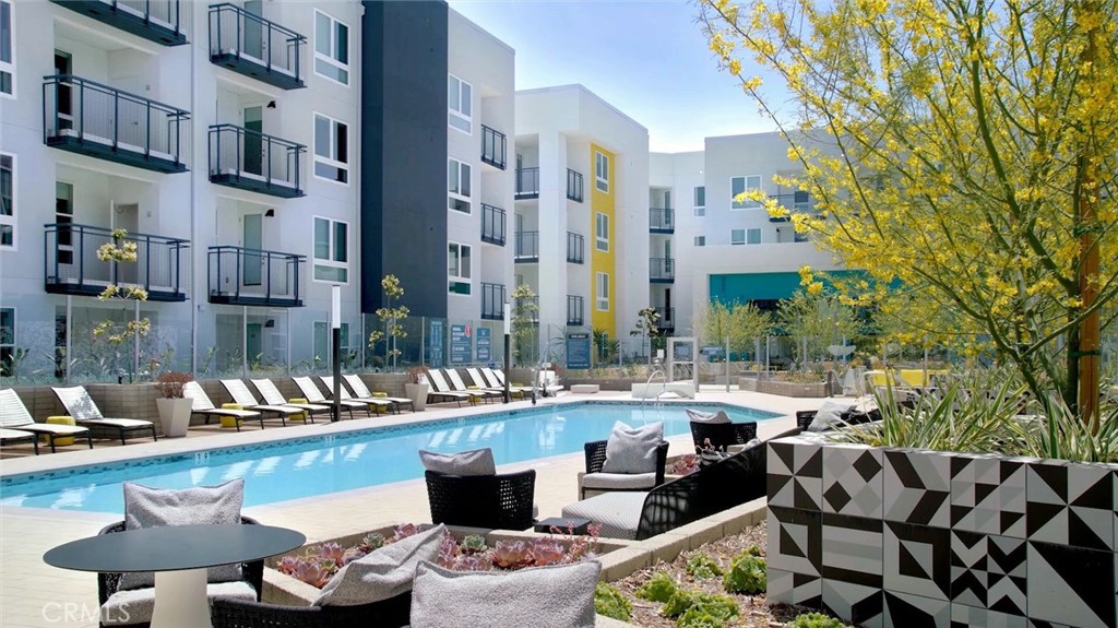 19525 Nordhoff Street, Unit 25662 Northridge, CA 91324 - Photo 13 of 26 a view of a patio with swimming pool