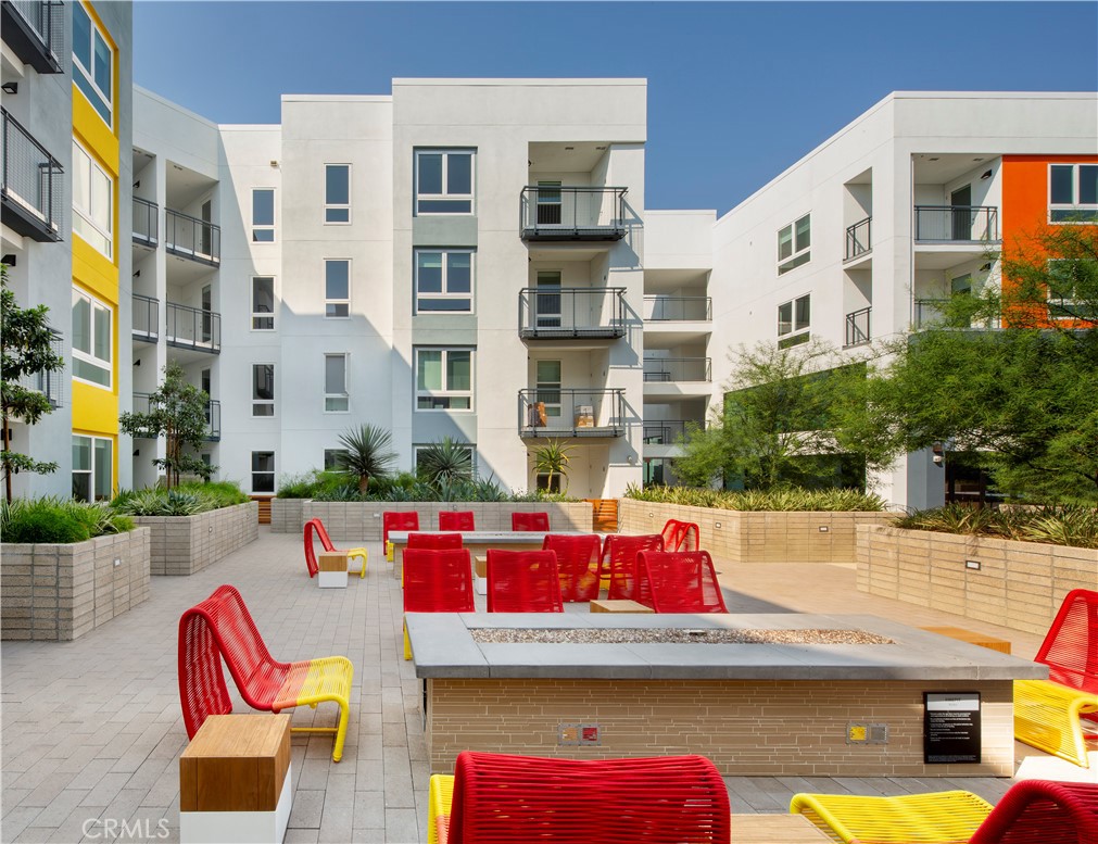 19525 Nordhoff Street, Unit 25662 Northridge, CA 91324 - Photo 14 of 26 a view of building with outdoor seating