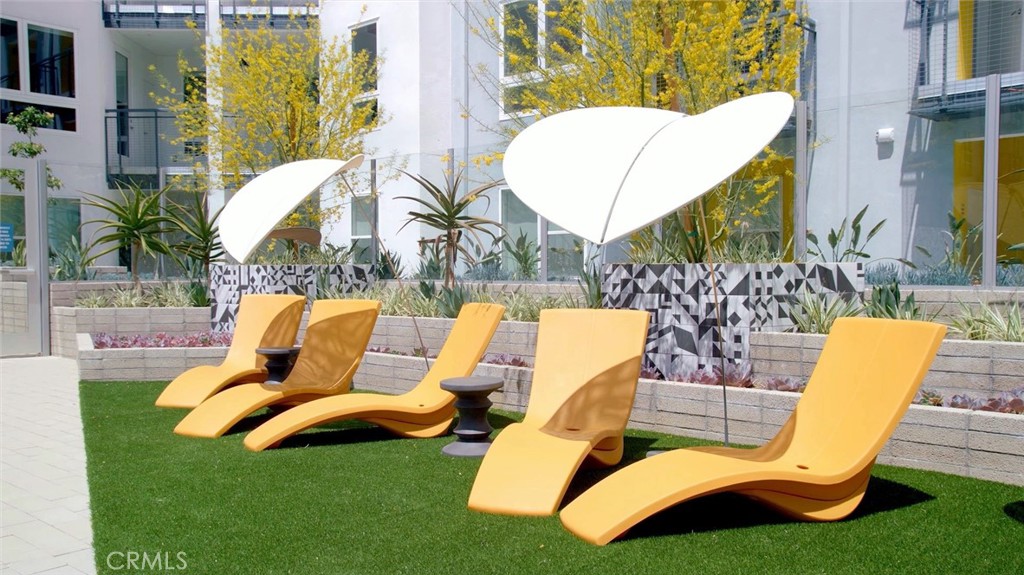 19525 Nordhoff Street, Unit 25662 Northridge, CA 91324 - Photo 15 of 26 a view of outdoor space yard swimming pool and patio