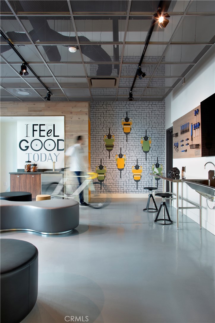 19525 Nordhoff Street, Unit 25662 Northridge, CA 91324 - Photo 17 of 26 a living room with furniture and a flat screen tv