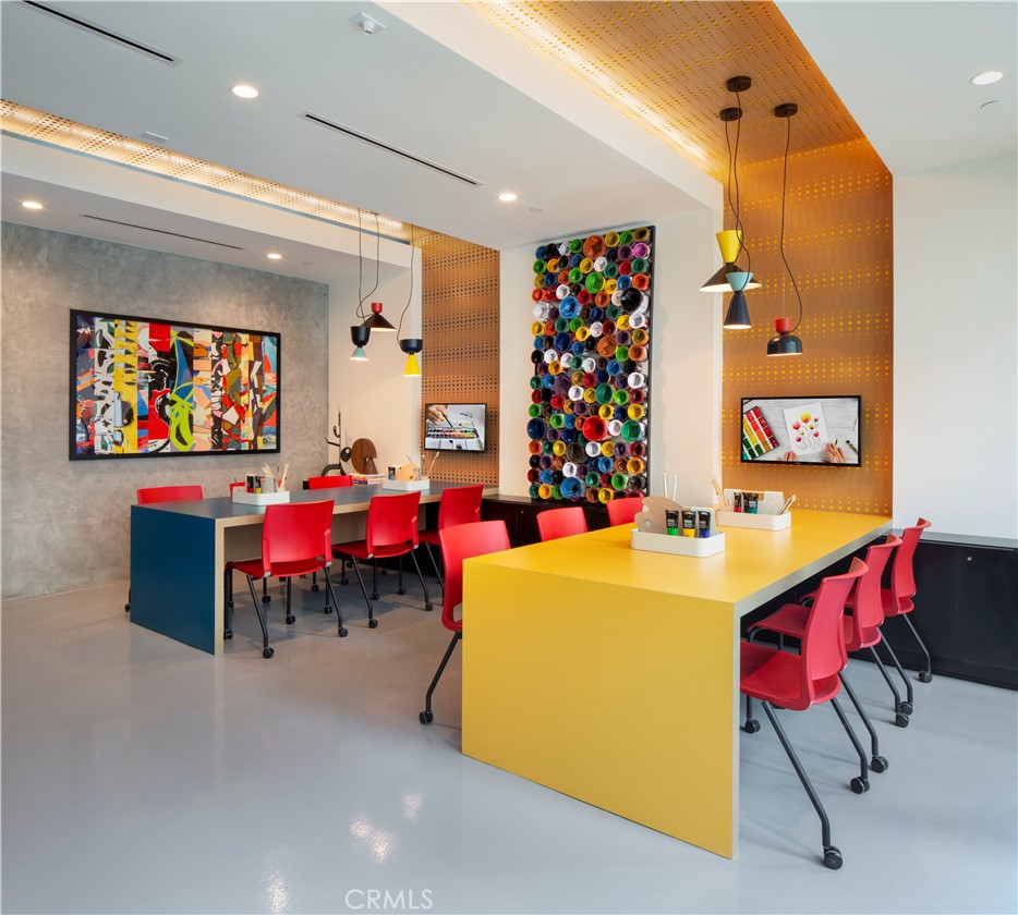 19525 Nordhoff Street, Unit 25662 Northridge, CA 91324 - Photo 20 of 26 a living room with furniture and a flat screen tv