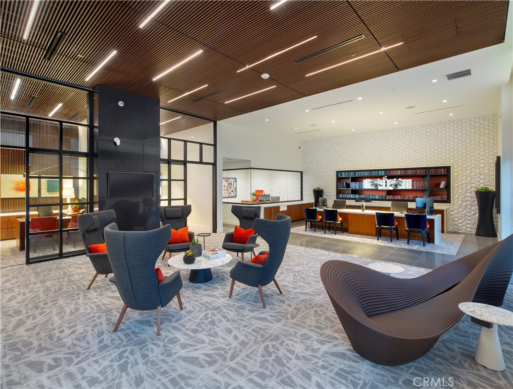 19525 Nordhoff Street, Unit 25662 Northridge, CA 91324 - Photo 8 of 26 a living room with furniture and a flat screen tv