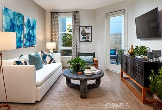 19525 Nordhoff Street, Unit 25662 Northridge, CA 91324 - Photo 9 of 26 a living room with furniture and a flat screen tv