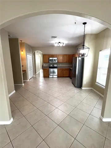 a view of a refrigerator and window in a room