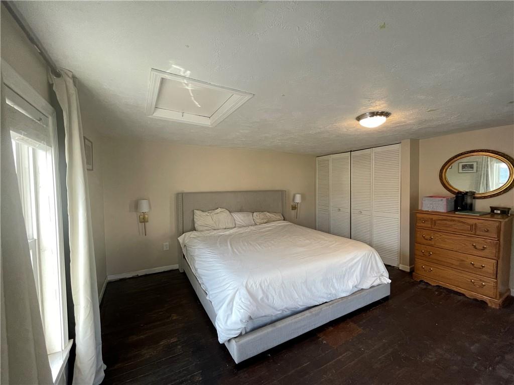 69 Hewitt Avenue Washington, PA 15301 - Photo 11 of 27 a bedroom with a bed and wooden floor