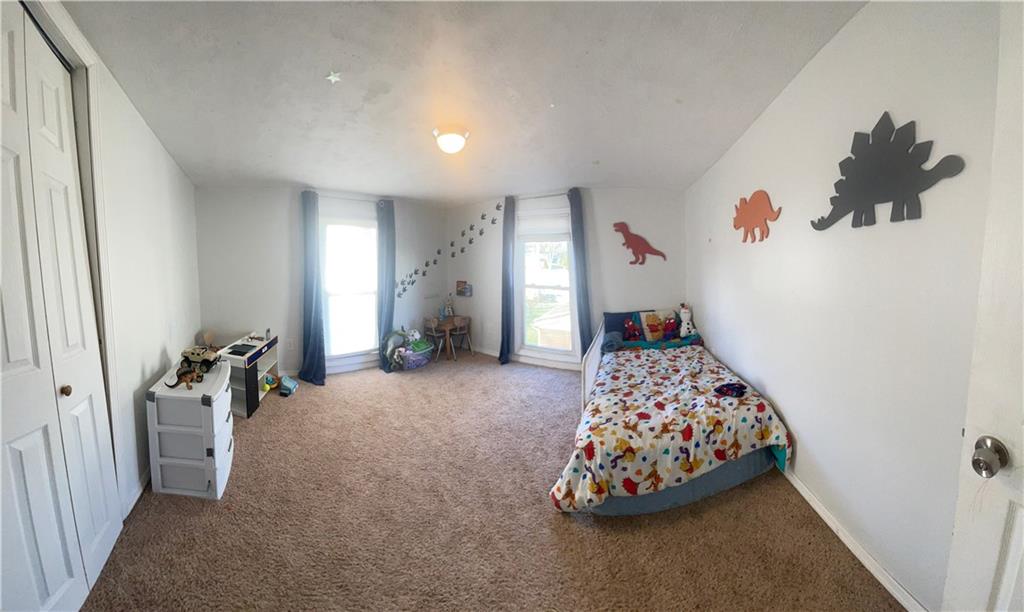 69 Hewitt Avenue Washington, PA 15301 - Photo 13 of 27 a bedroom with bed and a chandelier