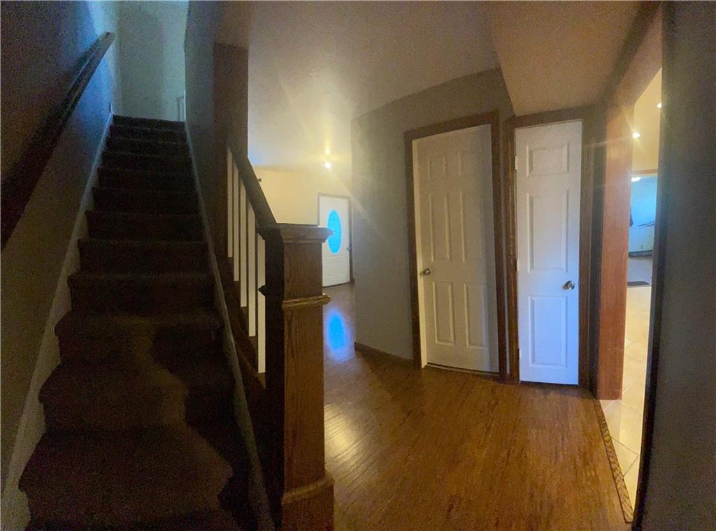 69 Hewitt Avenue Washington, PA 15301 - Photo 19 of 27 a view of a hallway with wooden floor and staircase