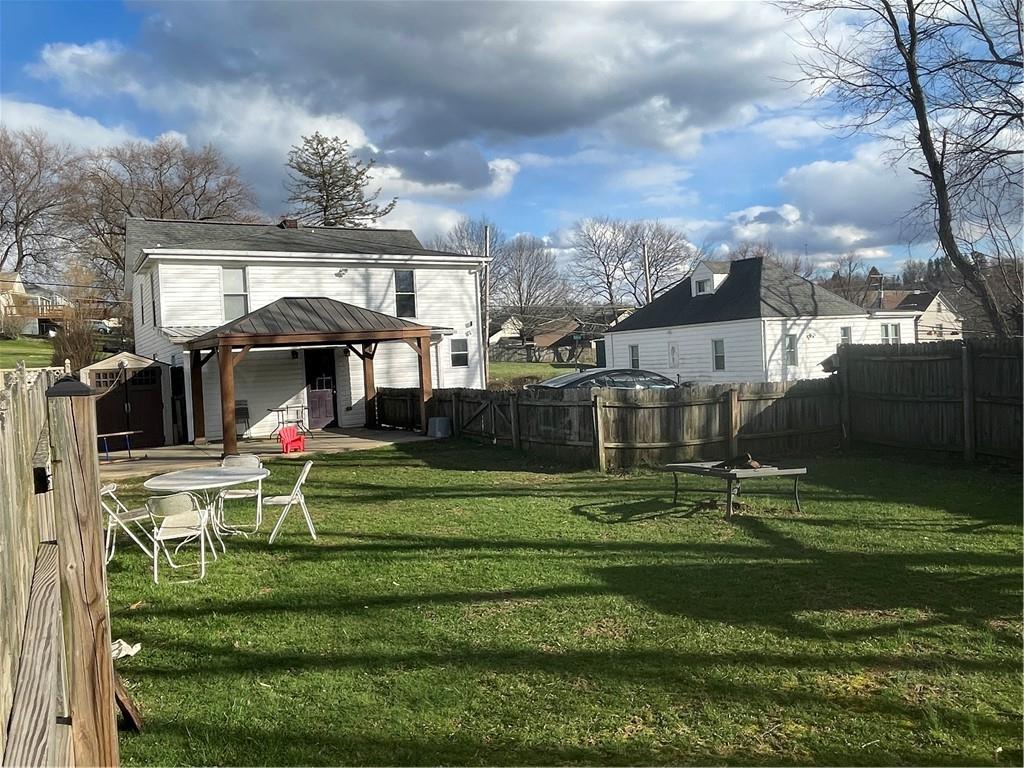 69 Hewitt Avenue Washington, PA 15301 - Photo 2 of 27 a front view of a house with a yard