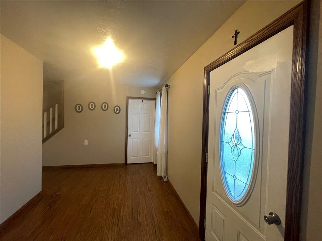 69 Hewitt Avenue Washington, PA 15301 - Photo 21 of 27 a view of an entryway with wooden floor & door