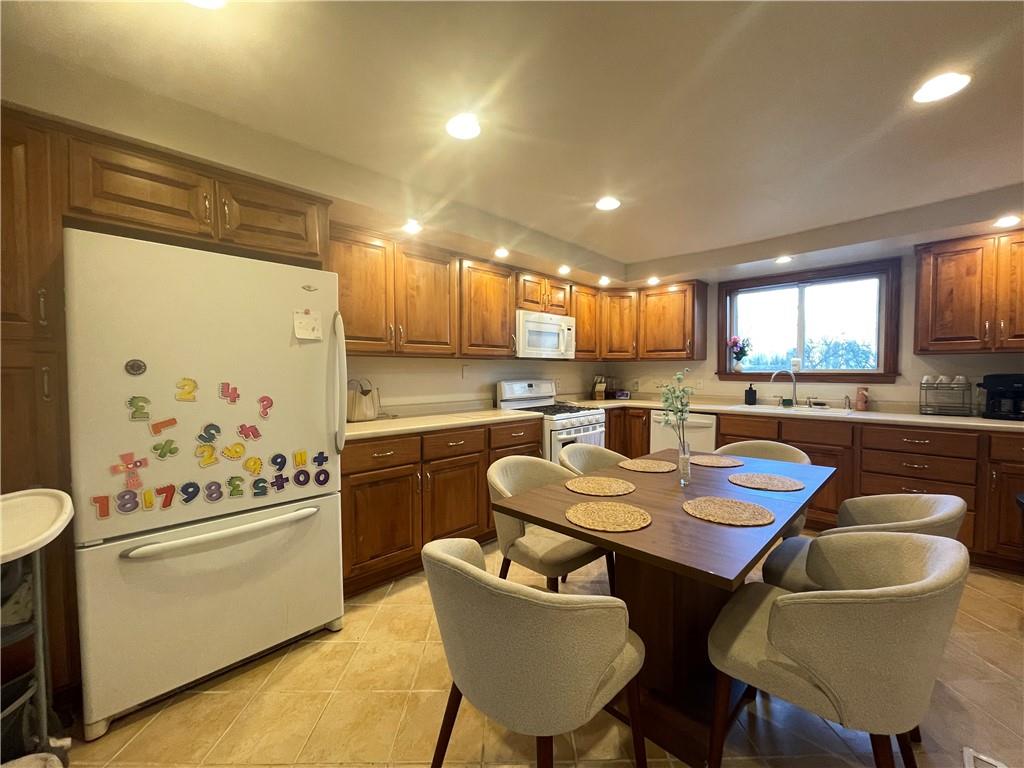 69 Hewitt Avenue Washington, PA 15301 - Photo 25 of 27 a kitchen with granite countertop white cabinets and stainless steel appliances