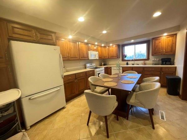 69 Hewitt Avenue Washington, PA 15301 - Photo 27 of 27 a kitchen with a table chairs refrigerator and a sink