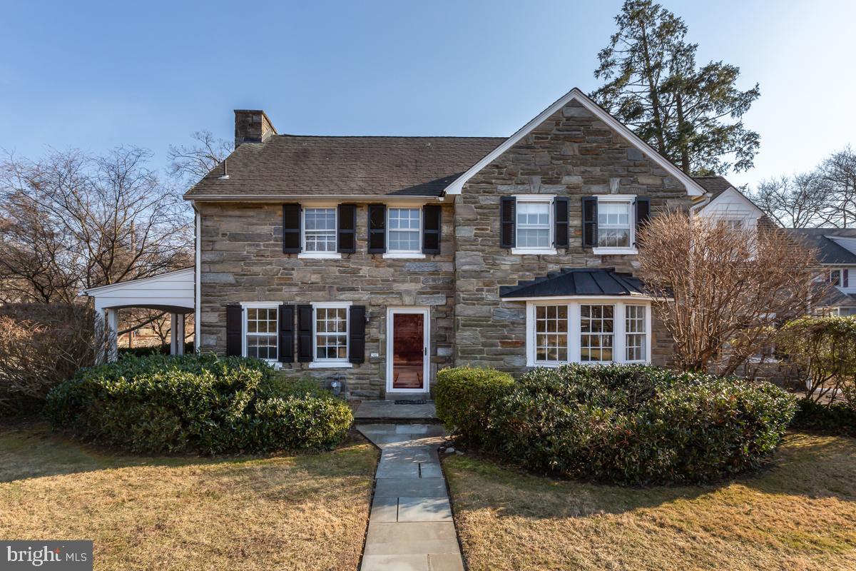 567 Manor Road Wynnewood, PA 19096 - Photo 1 of 34 a front view of a house with garden