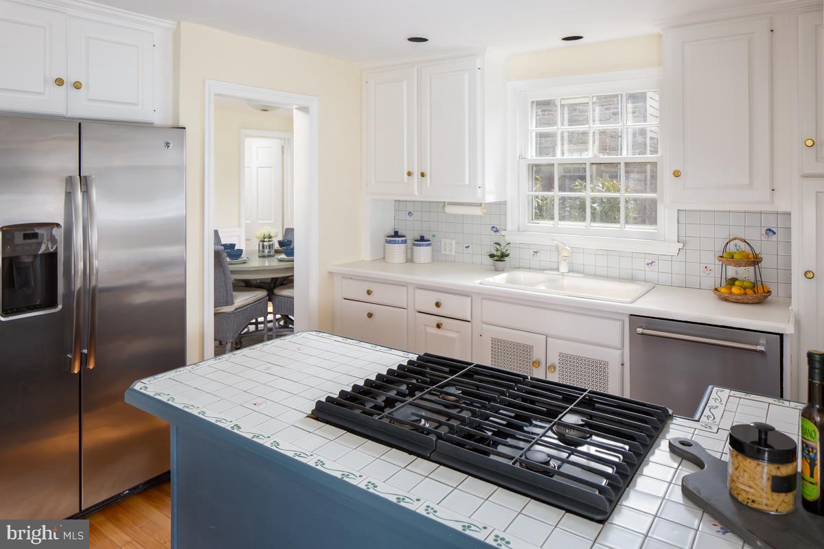567 Manor Road Wynnewood, PA 19096 - Photo 11 of 34 a kitchen with a sink stove and refrigerator