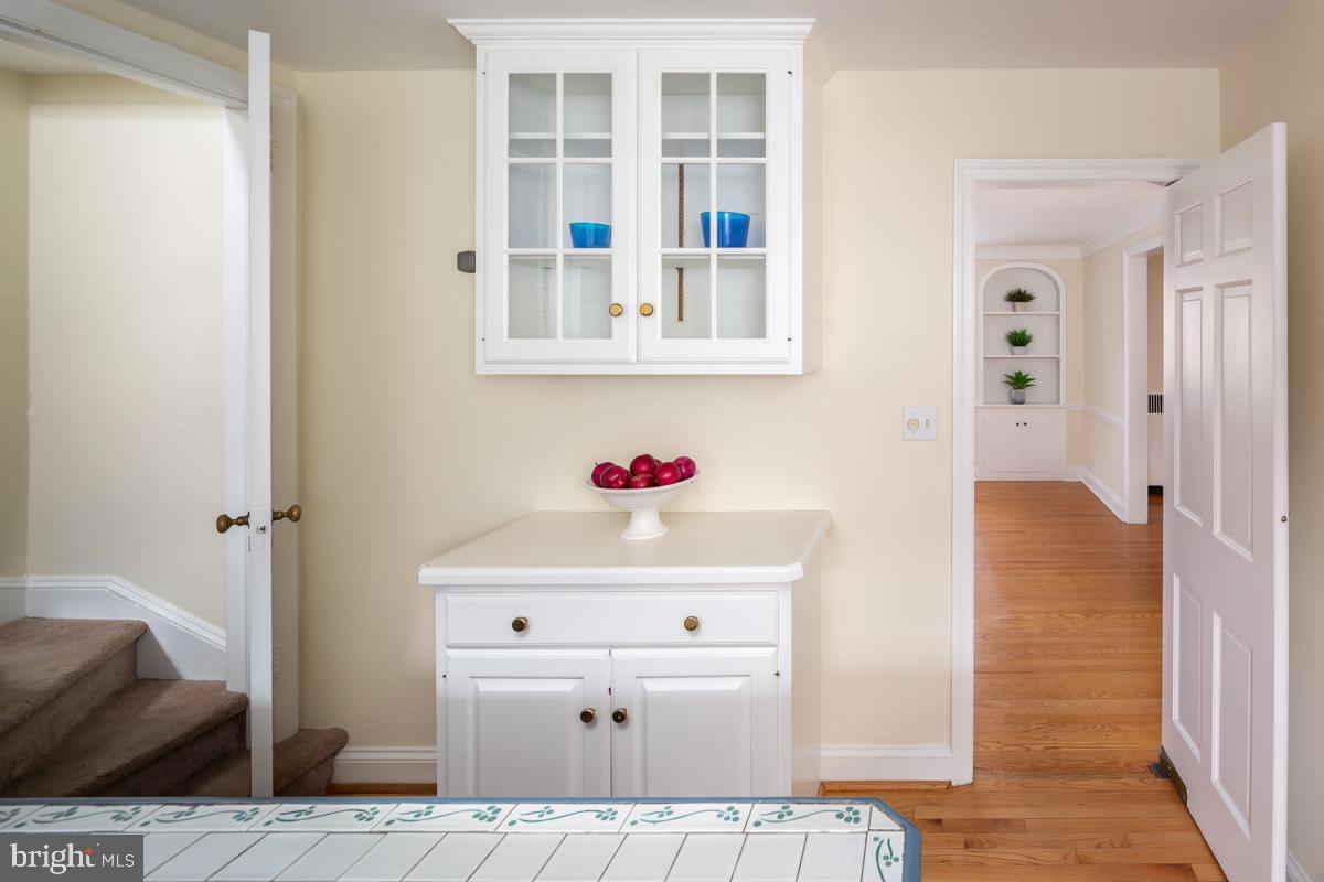 567 Manor Road Wynnewood, PA 19096 - Photo 13 of 34 a white cabinet sitting in a kitchen next to a window