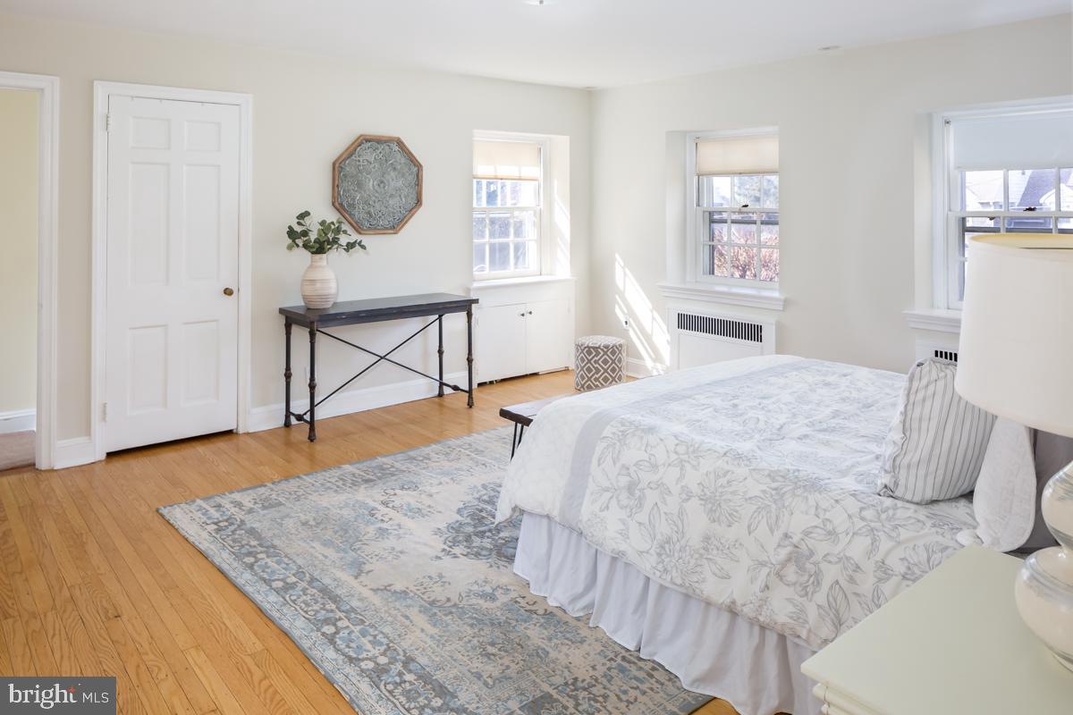 567 Manor Road Wynnewood, PA 19096 - Photo 16 of 34 a bedroom with a bed window and a table in it