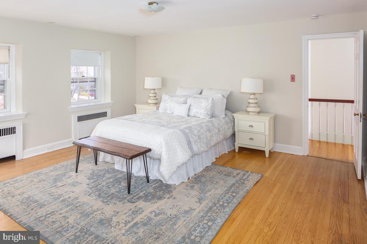 567 Manor Road Wynnewood, PA 19096 - Photo 17 of 34 a bed room with a bed and a chair