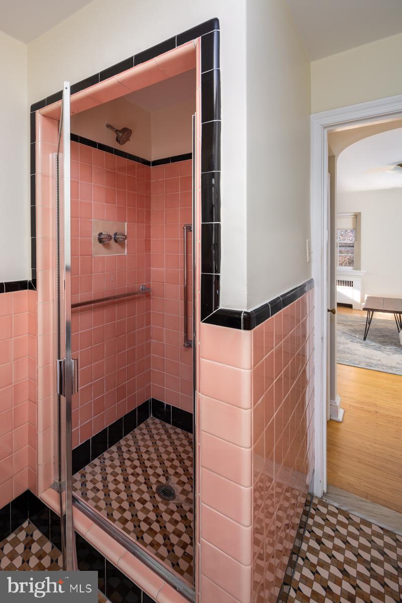 567 Manor Road Wynnewood, PA 19096 - Photo 20 of 34 a bathroom with a shower and a mirror