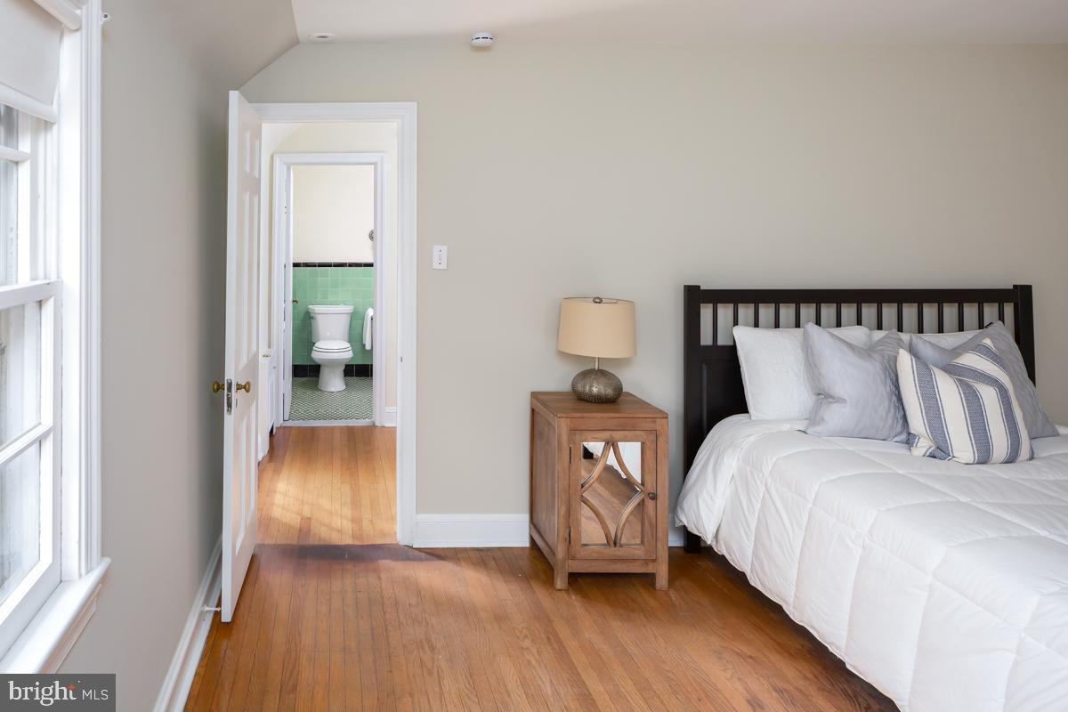 567 Manor Road Wynnewood, PA 19096 - Photo 21 of 34 a bedroom with a bed and a table