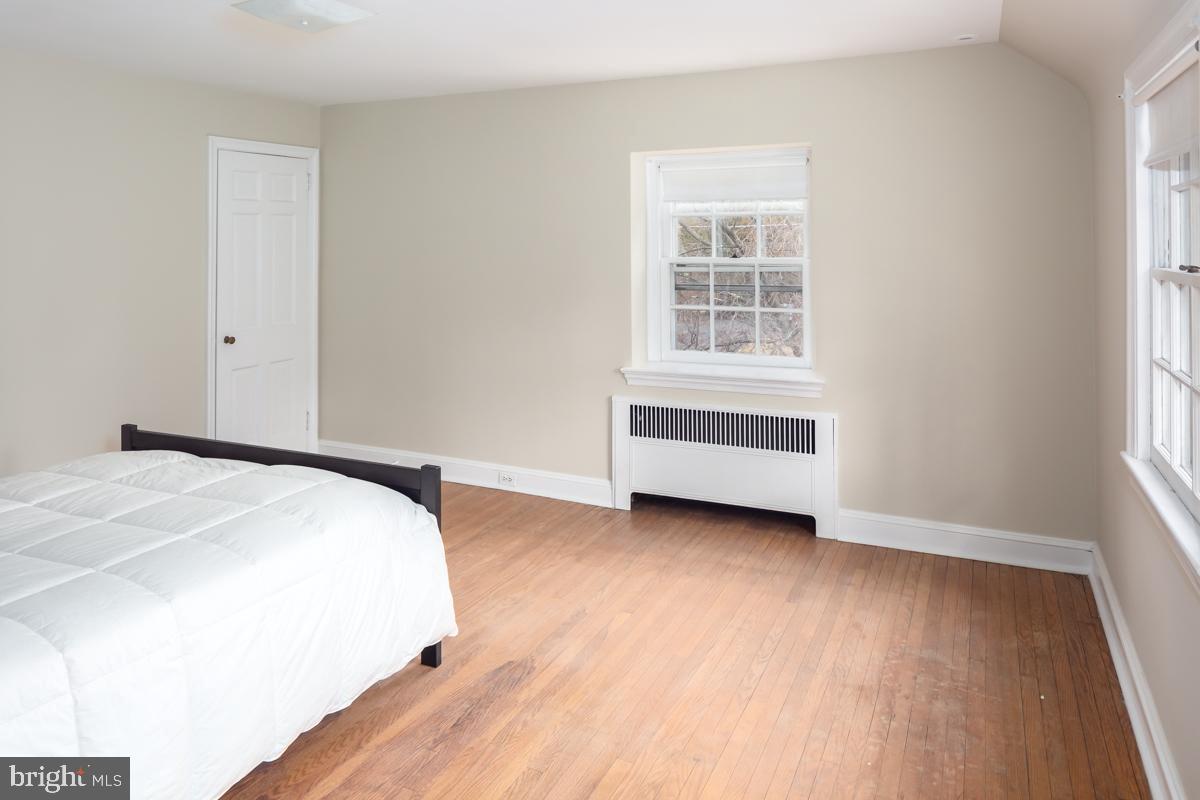 567 Manor Road Wynnewood, PA 19096 - Photo 22 of 34 a bedroom with a bed and a window