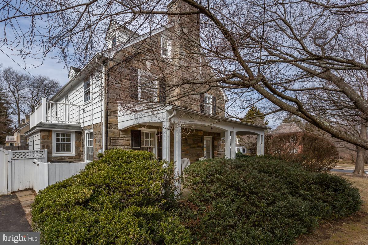 567 Manor Road Wynnewood, PA 19096 - Photo 33 of 34 a front view of a house with yard and trees around