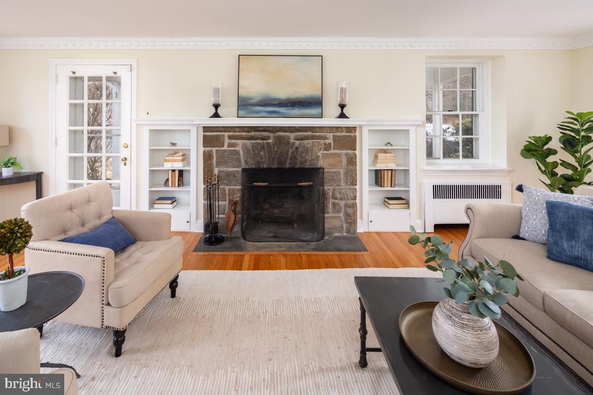 567 Manor Road Wynnewood, PA 19096 - Photo 6 of 34 a living room with furniture and a fireplace