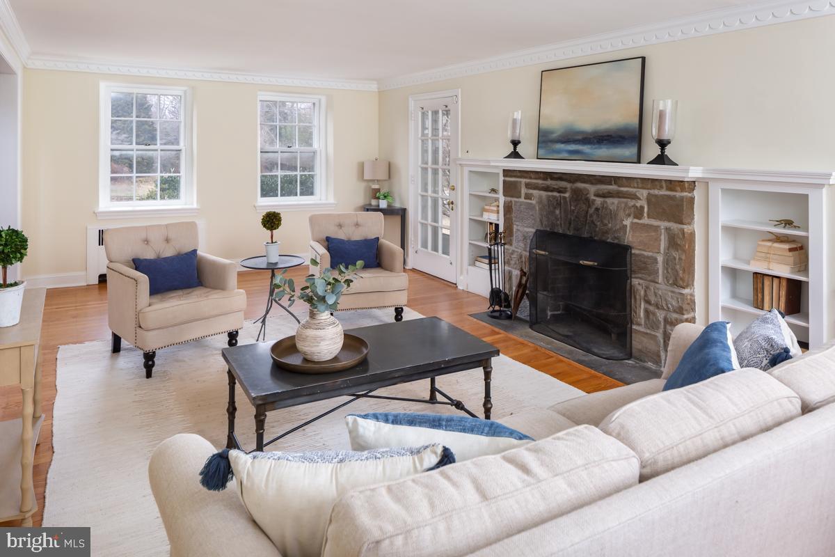 567 Manor Road Wynnewood, PA 19096 - Photo 7 of 34 a living room with furniture and a fireplace