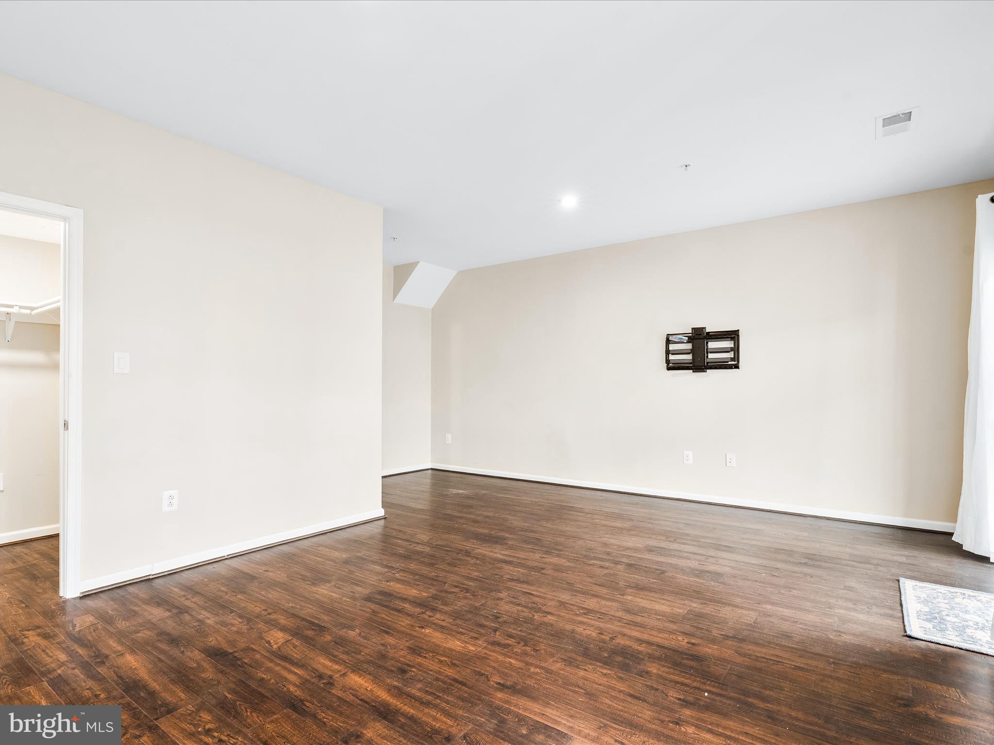 8479 Randell Ridge Road Frederick, MD 21704 - Photo 8 of 48 a view of an empty room with wooden floor