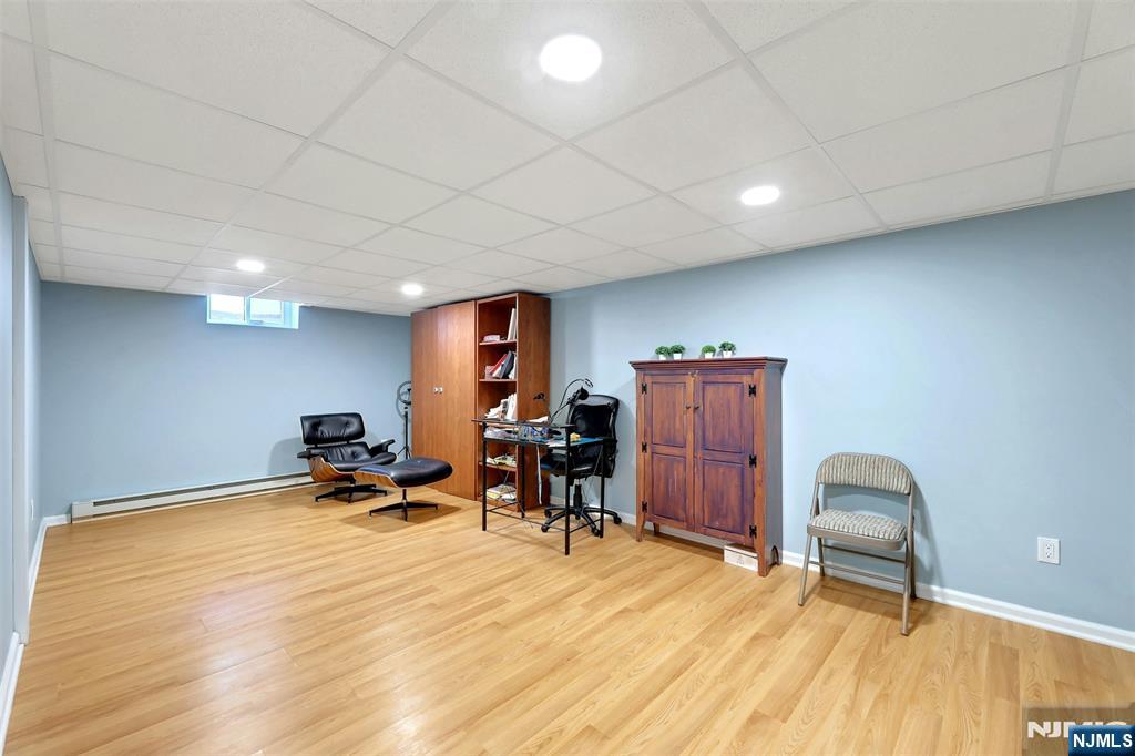 514 Rutland Avenue Teaneck, NJ 07666 - Photo 28 of 40 a room with furniture and wooden floor